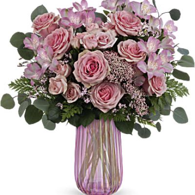 This Mother's Day…think pink! Teleflora's Rosy Iridescence Bouquet features beautiful pink roses in a shimmering, iridescent pink glass vase that Mom is sure to love.