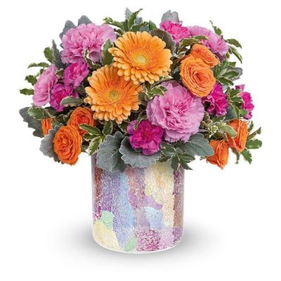 Joyful roses and gerberas bring happiness wherever they go! Especially when presented in this stunning mosaic glass vase with shimmering iridescent finish.