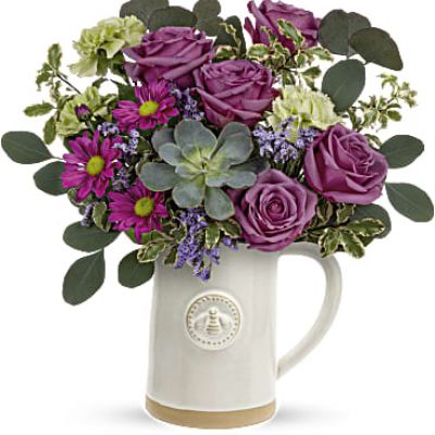 Make Mom feel like the Queen Bee she is with this charming bee-embossed pitcher and Mother's Day floral arrangement! The glazed stoneware design is food safe for years of enjoyment and makes the perfect partner for a fresh, garden-inspired rose bouquet on her special day.