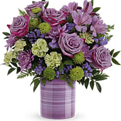 Hand-painted with swirling stripes of purple, this cute keepsake vase bursts with a fresh bouquet of lovely lavender roses to make mom's day feel extra special!